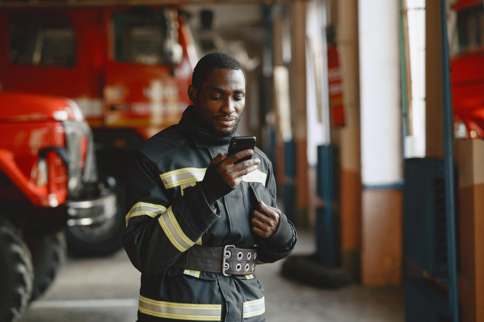 First responder taking a moment with his phone